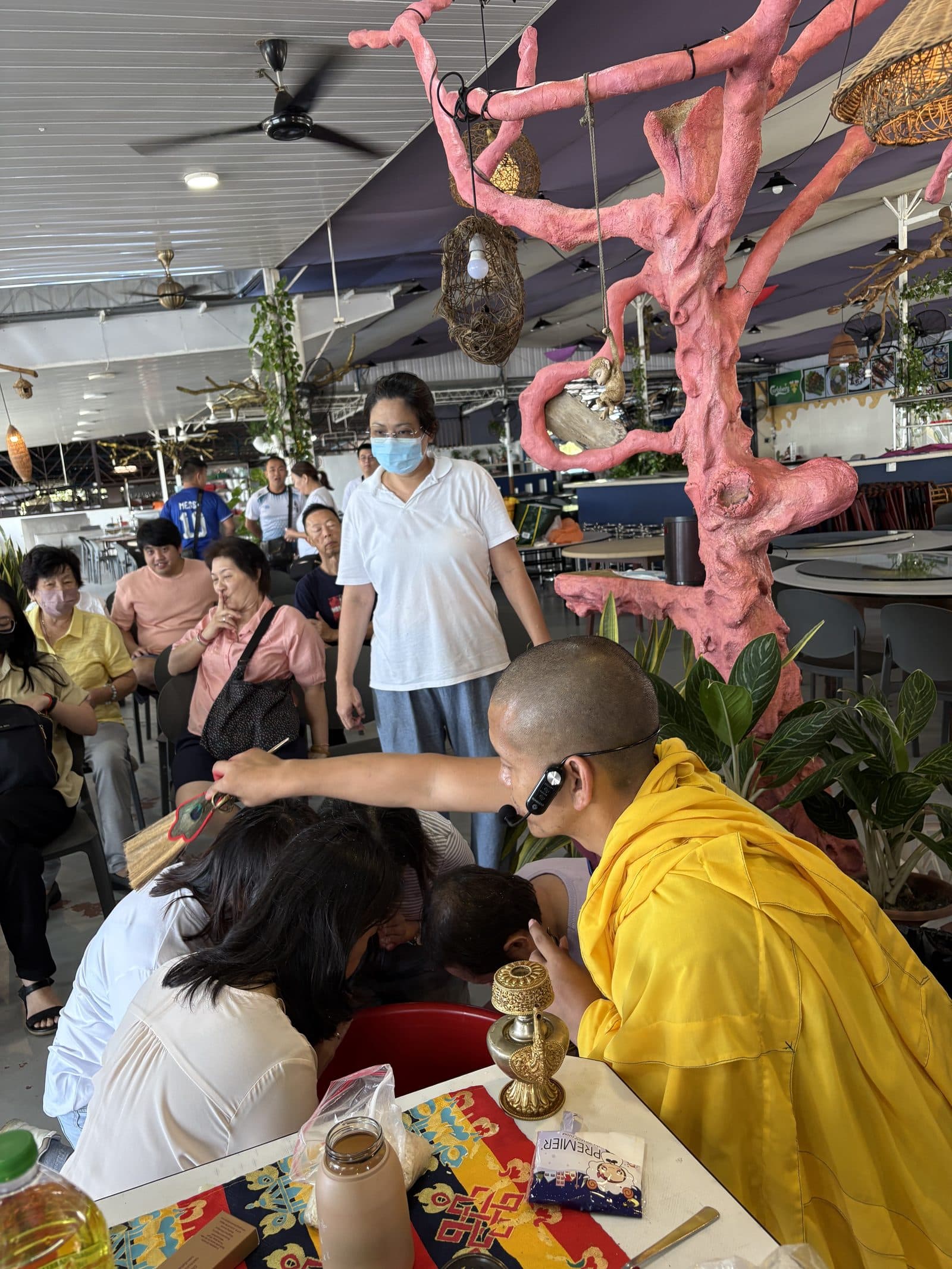 Khen Rinpoche giving blessings to the Penang sangha